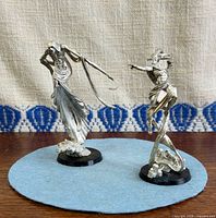 Both unpainted metal C'tan miniatures on bases