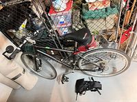 Left side view of bicycle showing frame, wheels, accessories and storage bags