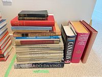 Overall lot showing three stacks of books