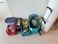 Overall lot view showing hand truck, crates, tubs and contents