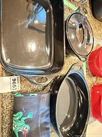 Overview of rectangular dish, oval baker base, apron visible