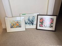 Group shot of three framed watercolour paintings