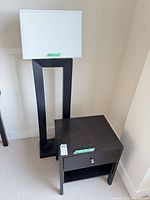 Floor lamp beside one nightstand showing scale, color, style