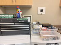 Overall view of Stanley chest with WD-40 and bin of bulbs