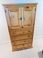 Front view showing cabinet doors and four drawers