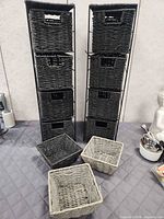 Two storage towers and three loose baskets on tabletop