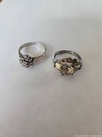 Both sterling silver rings side by side on white background