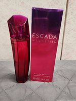 Bottle and box front view showing brand and volume