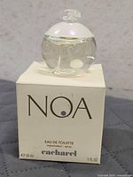 Box front and bottle of Cacharel Noa 30 ml EDT