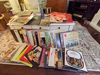 Wide shot of approximately 150 LPs on table with sleeves visible