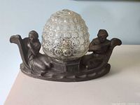 Front view of lamp with glass shade in place