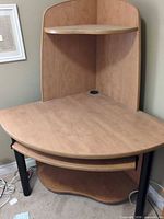 Overall view of corner desk showing desktop, hutch shelf, keyboard tray, lower shelf