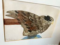 Front view showing artwork, mat, portion of frame