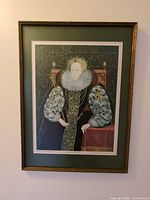 Front view of framed Elizabeth I portrait print in gold wooden frame