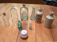 All nine assorted bottles and jar displayed