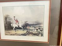 Close view of first framed print showing rider on white horse