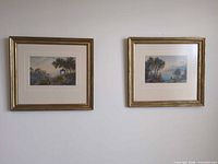 Both framed prints on wall, showing size and matching frames