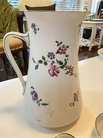Tall porcelain pitcher with floral transfer decoration