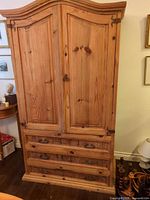 Front view of solid pine armoire closed