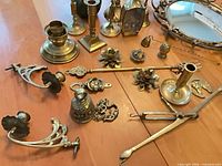 Overview of assorted brass items on table