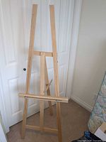 Front view of full standing wood H-frame easel