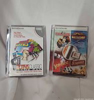 Front view of both Handmark game packs showing titles and artwork