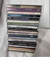 Stacked view of all CD spines showing artists and titles