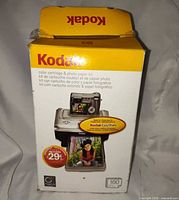 Front view of sealed Kodak cartridge & paper kit box showing product details and 160-print yield