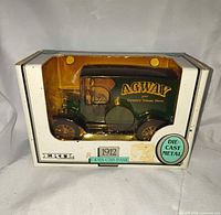 Front view of boxed ERTL 1912 Open Cab Bank die-cast truck