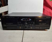 Front angled view showing both cassette wells, controls, and display