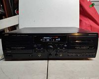 Front view of JVC TD-W354 showing both cassette wells and controls