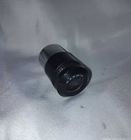 Front angled view of K 25mm lens showing body and knurled ring