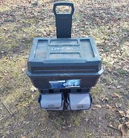 Front view of Kobalt rolling cart showing lid, logo, and two fabric pouches