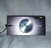 Front view showing lilac body, dual-lens cover, Kodak logo, wrist strap