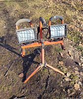 front view of dual-head halogen work light on tripod