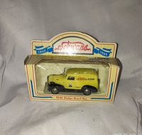 Front view of boxed yellow Schwan's 1946 Dodge panel van die-cast car