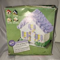 Front of boxed Wilton stand-up house pan