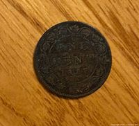 Reverse side showing ONE CENT 1897 with wreath