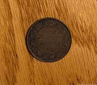 Reverse side of 1915 Canadian 1-cent coin showing ONE CENT within vine-leaf wreath