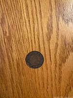 Obverse of 1920 Canadian large cent on wood surface