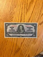 Obverse of 1937 $10 bill showing portrait, serial number, denomination