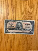 Obverse of 1937 Canada $2 note showing portrait, serial, signatures