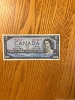 Obverse of 1954 Canada $5 bill showing Queen Elizabeth II portrait and serial number 78383270