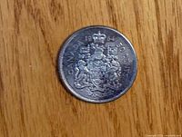 Reverse of 1964 Canadian 50¢ showing coat of arms