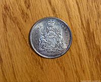 Reverse side showing Canadian Coat of Arms and date 1965