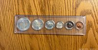 Wildlife design side of six 1967 Canadian coins in holder
