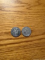 Obverse sides of both 50-cent coins