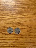 Both coins reverse side with mackerel design visible