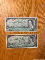 Fronts of both 1967 Canadian $1 banknotes