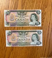 Fronts of both 1979 $20 notes showing portrait and denomination